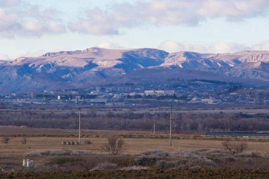 Mountain and town landscape during sunset in Kaspi, Georgia