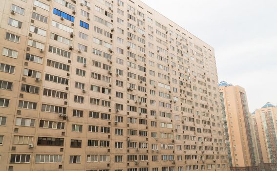 Facade of a modern multi storey residential complex. Urban architecture