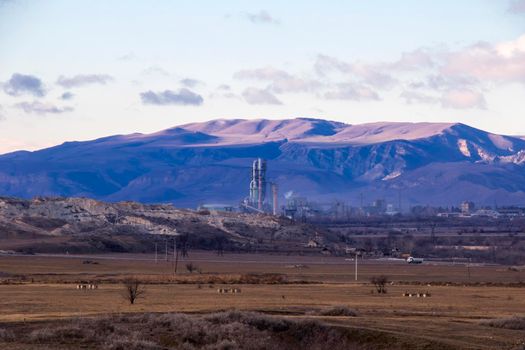 Mountain and town landscape during sunset in Kaspi, Georgia