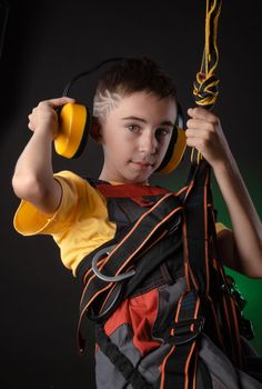 the child the Builder costume posing with a work tool