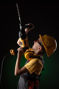 child the Builder costume posing with a work tool