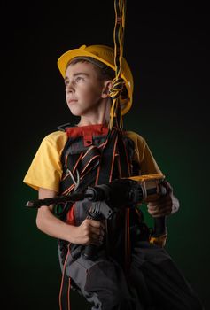 the child the Builder costume posing with a work tool