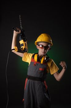 child the Builder costume posing with a work tool