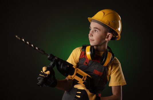 the child the Builder costume posing with a work tool