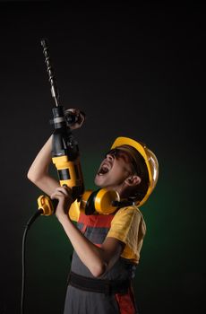 child the Builder costume posing with a work tool