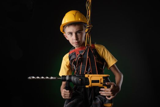 the child the Builder costume posing with a work tool