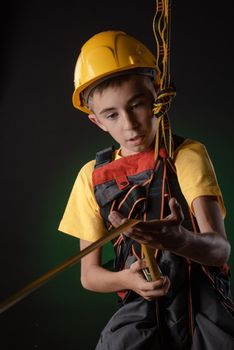 the child the Builder costume posing with a work tool