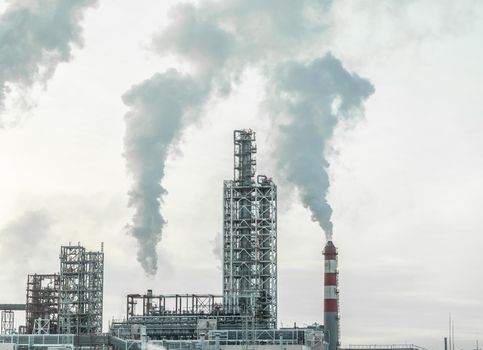 Petrochemical industrial factory of heavy industry, power refinery production with smoke pollution.Thick smoke is coming from the factory's chimney. smoke smog emissions bad ecology aerial photography