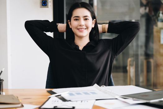 The female employee shows a smiley face after completing the task at the end of the time