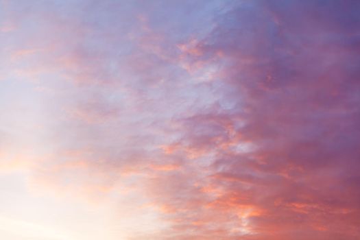 Colorful pink clouds in the sky at sunrise or sunset. Natural natural background.