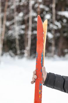 Skis are stuck in the snow in winter. Active winter holidays in the mountains or in the forest on skis. Parking and rest.