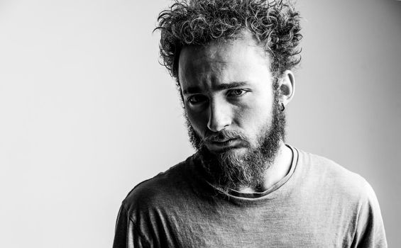 Young Man in Deep Drama Thinks how to Solve his Problems, Depression, Apathy. Depressed Guy, Black and White. Close-up. Copy Space.