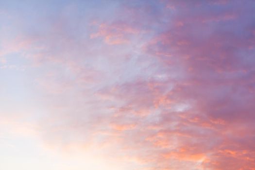 Colorful pink clouds in the sky at sunrise or sunset. Natural natural background.