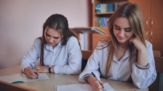 Pupils of the 11th grade in the class at the desks during the lesson. Russian school