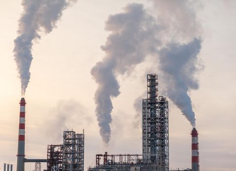 Petrochemical industrial factory of heavy industry, power refinery production with smoke pollution.Thick smoke is coming from the factory's chimney. smoke smog emissions bad ecology aerial photography