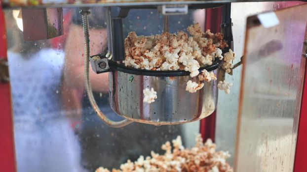 Cooking tasty colorful popcorn on the street