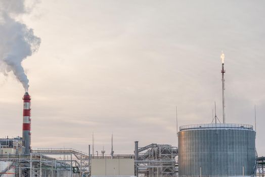 Petrochemical industrial factory of heavy industry, power refinery production with smoke pollution.Thick smoke is coming from the factory's chimney. smoke smog emissions bad ecology aerial photography