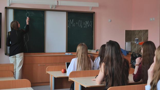Pupils of the 11th grade in the class at the desks during the lesson. Russian school