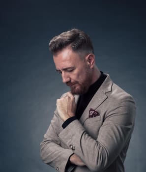 Frustrated middle aged elegant man Close up face of a stressed businessman wearing a stylish suit with eyes closed. Side shot