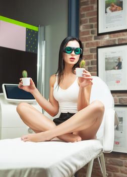 woman in a laser hair removal studio with a cactus in her hand as a symbol of unwanted hair growth