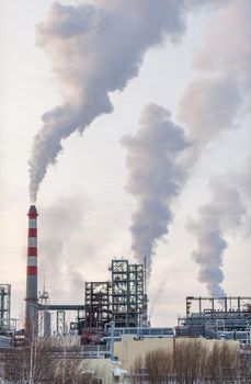 Petrochemical industrial factory of heavy industry, power refinery production with smoke pollution.Thick smoke is coming from the factory's chimney. smoke smog emissions bad ecology aerial photography