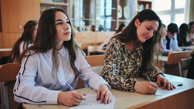 Pupils of the 11th grade in the class at the desks during the lesson. Russian school