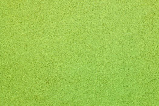 An old painted cement wall. Beautiful green stucco Background.