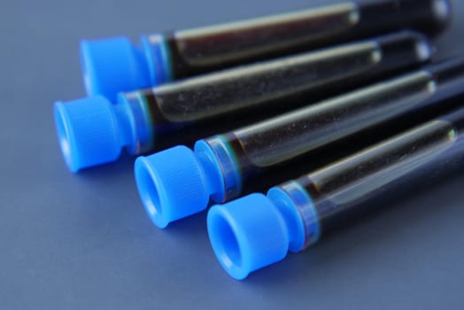 close up of blood test tube on table .