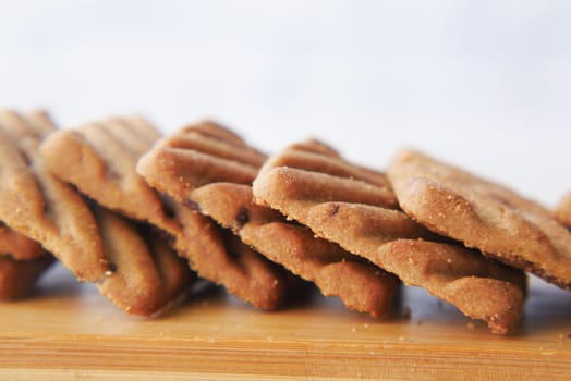 close up of sweet cookies on wooden table .