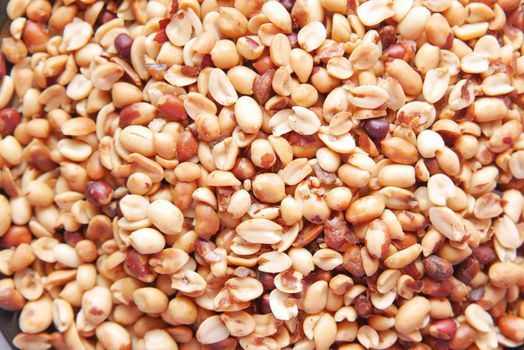 Processed pea nuts in a bowl on table top down