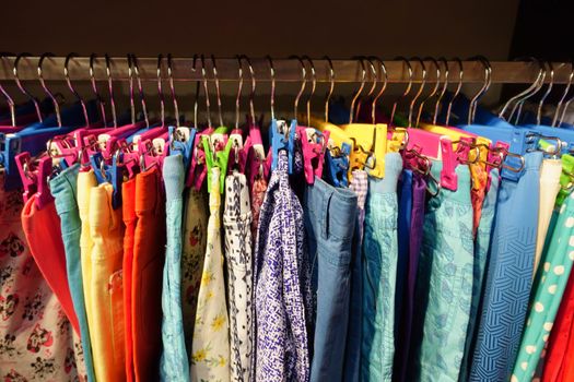 close up of many child cloths display for sale .