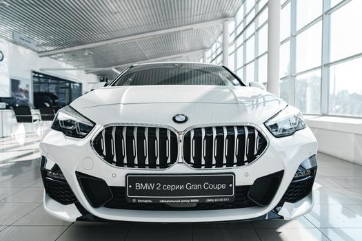 KRASNODAR, RUSSIA - NOVEMBER 19, 2020: White BMW Series 2 Gran Coupe in car showroom, close up