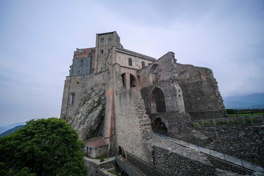 Sacra di San Michele in Turin, view from below of the cliff and walls. High quality photo
