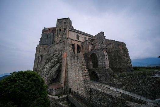 Sacra di San Michele in Turin, view from below of the cliff and walls. High quality photo