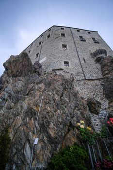 Sacra di San Michele in Turin, view from below of the cliff and walls. High quality photo