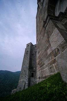 Sacra di San Michele in Turin, view from below of the cliff and walls. High quality photo