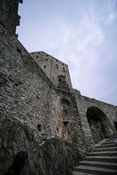 Sacra di San Michele in Turin, view from below of the cliff and walls. High quality photo