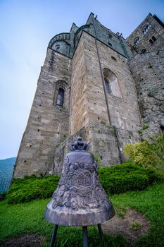 Sacra di San Michele in Turin, view from below of the cliff and the bell. High quality photo