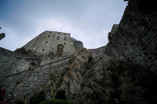 Sacra di San Michele in Turin, view from below of the cliff and walls. High quality photo