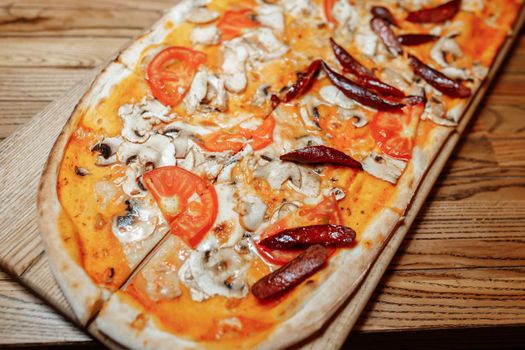 Pizza on wooden table top view. Fast food. Post blog social media. with copy space. Pizza ready to eat.