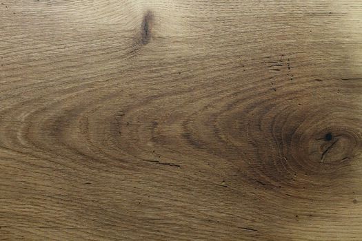 Wood texture. Wooden board close up. The cracks are deep. Laminate flooring. Tree rings in a cut.