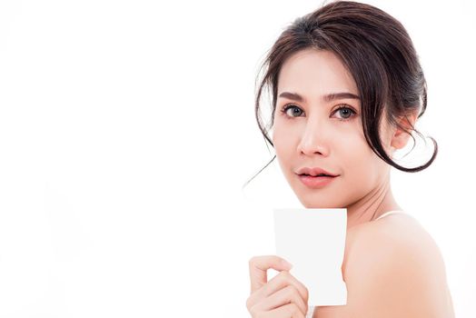 Asian young beautiful woman smiling she's holding blank square skin care near face for present product isolated on over white background, Beauty concept