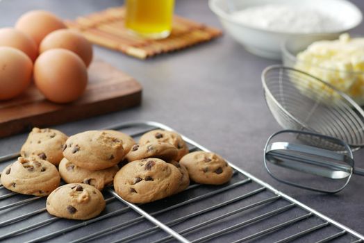 chicken eggs and baking ingredients on a wooden board,