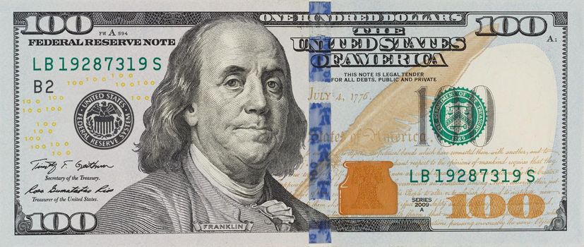 The denomination hundred dollars on isolated white background. new
