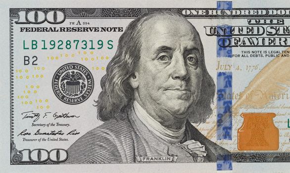 The denomination hundred dollars on isolated white background. new