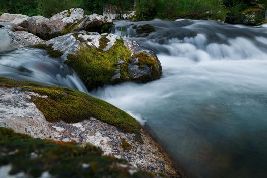 Small rivers with stones in long exposure. Siberia