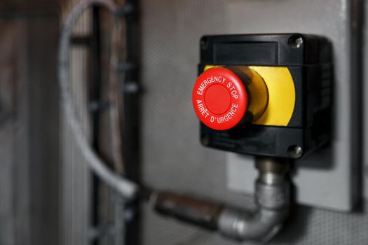 The red emergency button or stop button for Hand press. STOP Button for industrial machine, Emergency Stop.
