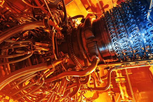 Gas turbine engine located inside the aircraft. Clean energy in a power plant used on an offshore oil and gas refining central platform. Oil gas, ecology and clean energy concept. Power and takeoff