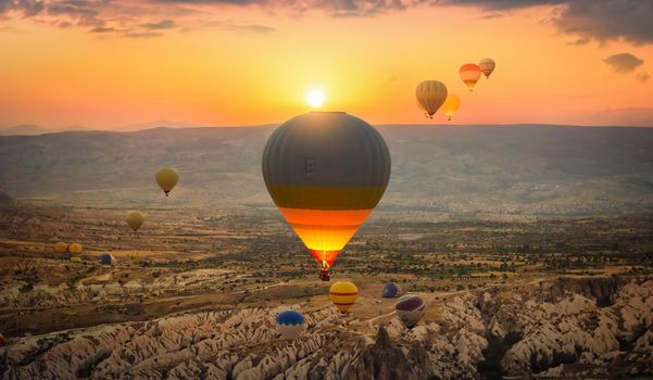 hot air balloons over the plateau in Cappadocia