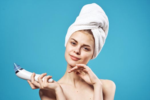 cheerful woman with bare shoulders towel on head skin care dermatology. High quality photo